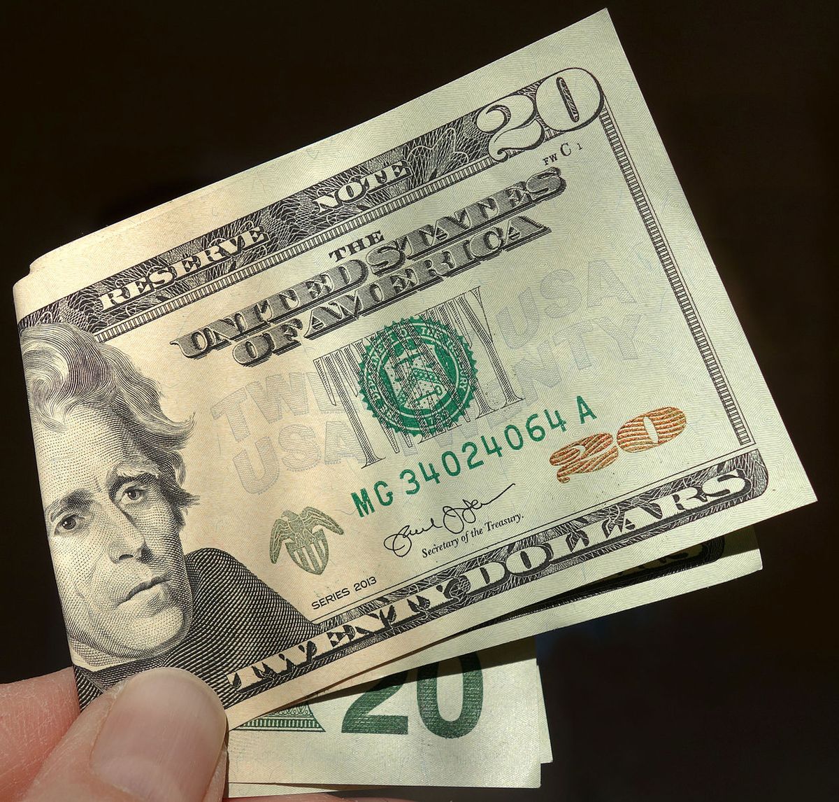 Folded US twenty-dollar banknotes